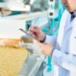 Factory inspector taking notes 2025 03 06 01 21 16 utc 1 scaled