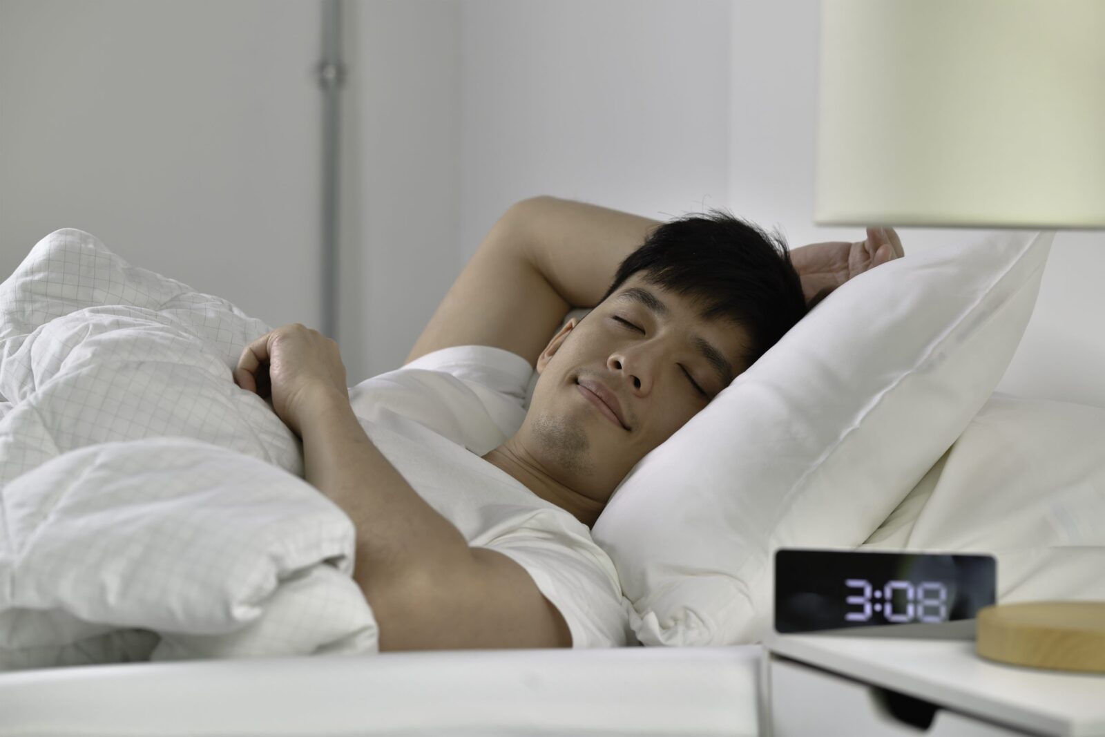 Handsome young asian man sleeping bed scaled