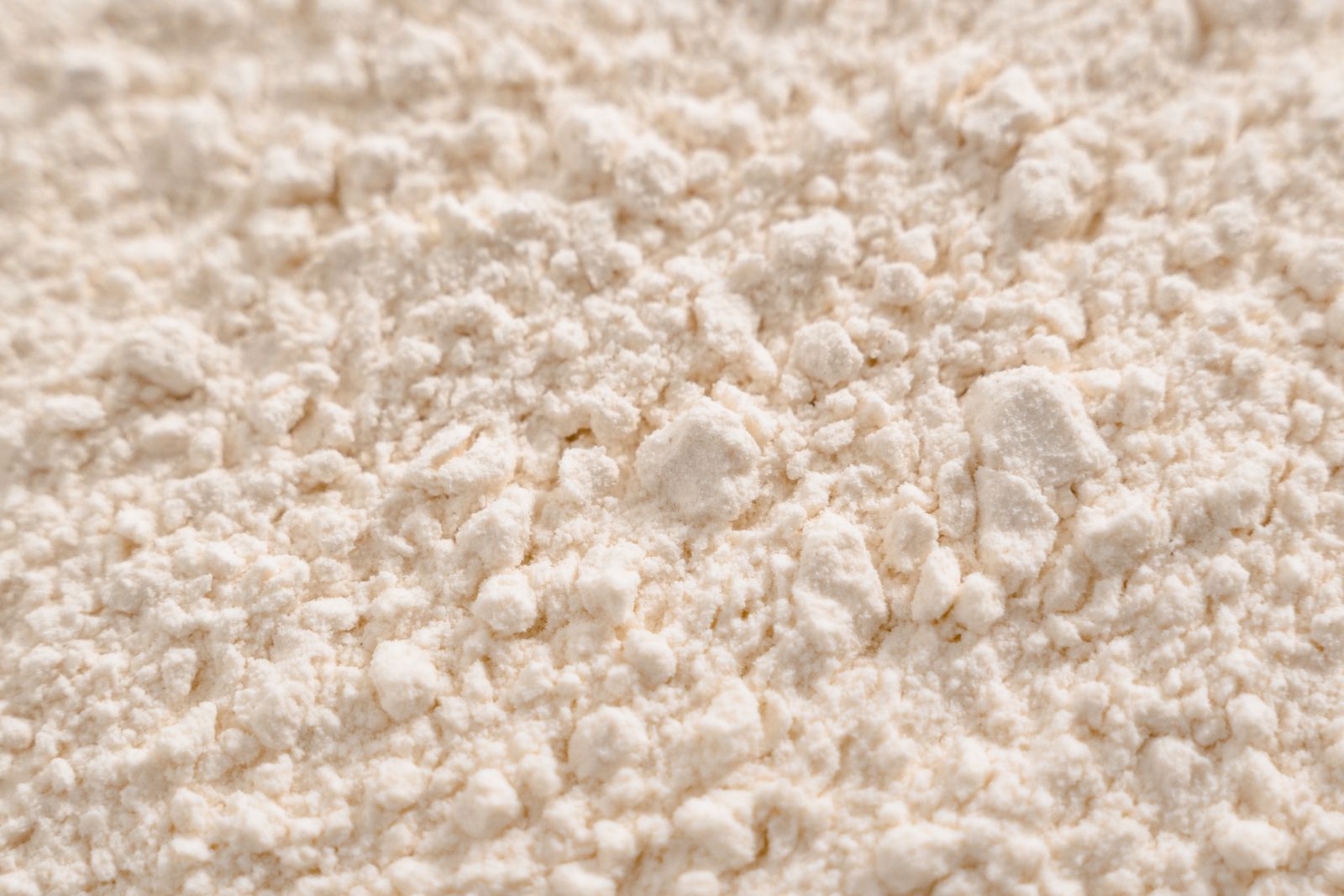 Detailed close-up of a white powder texture, resembling flour or sugar.