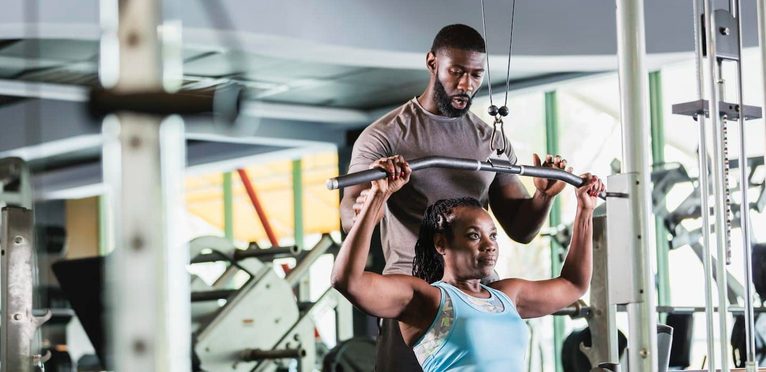 Imgi 158 personal trainer and client at gym