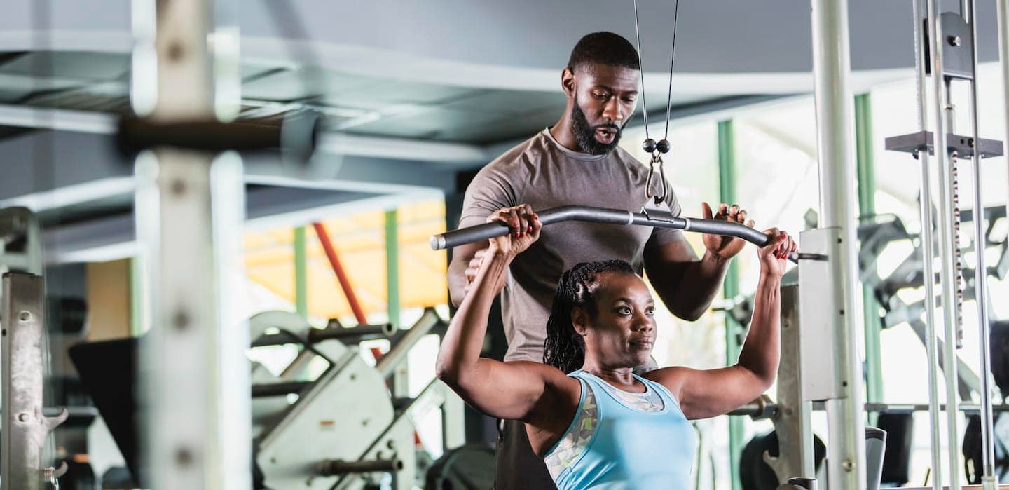 Imgi 158 personal trainer and client at gym