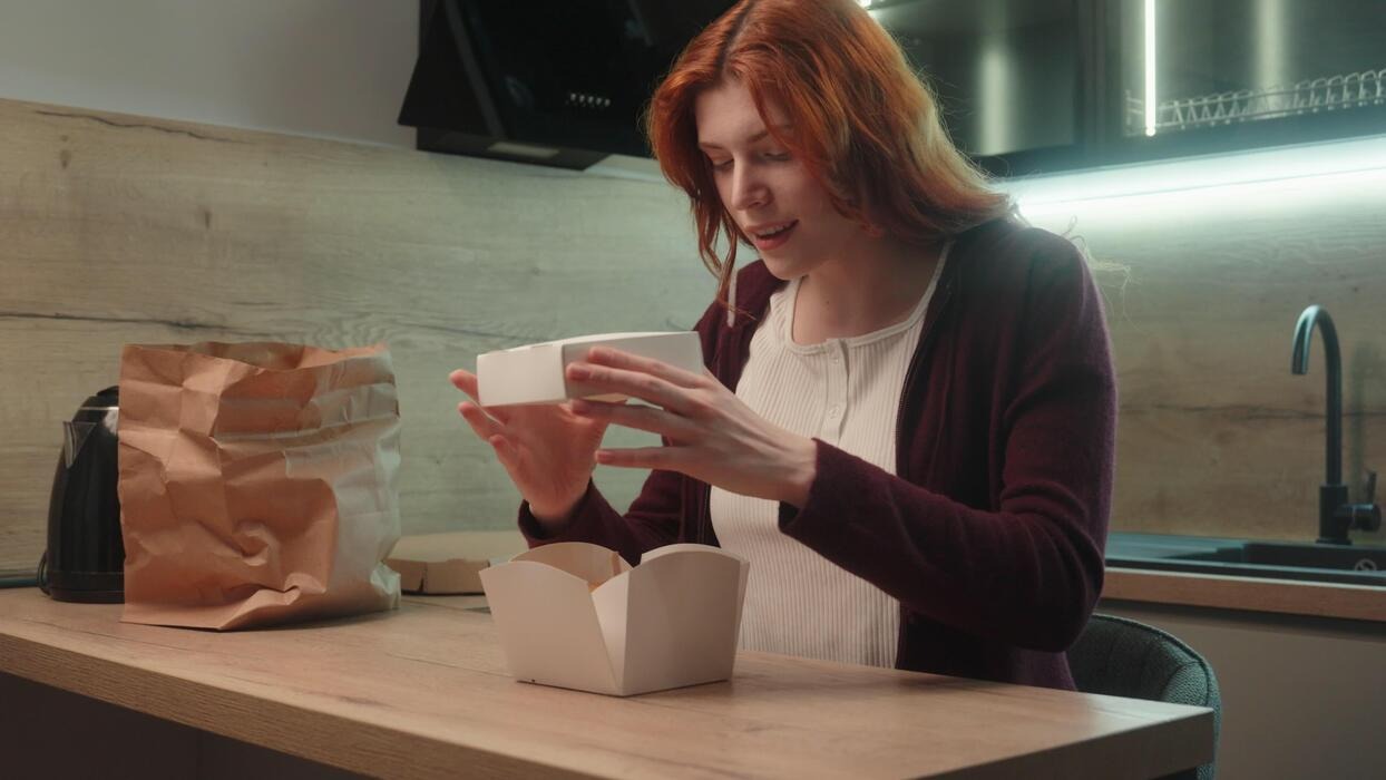Imgi 169 surprised happy excited caucasian woman client female customer buyer girl open order tasty burger cardboard box cheeseburger hamburger lady enjo