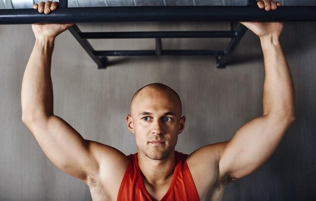 Imgi 207 thinking pull up man focus fitness power performance arm strength growth muscle building development idea mindset strong male athlete contemplat