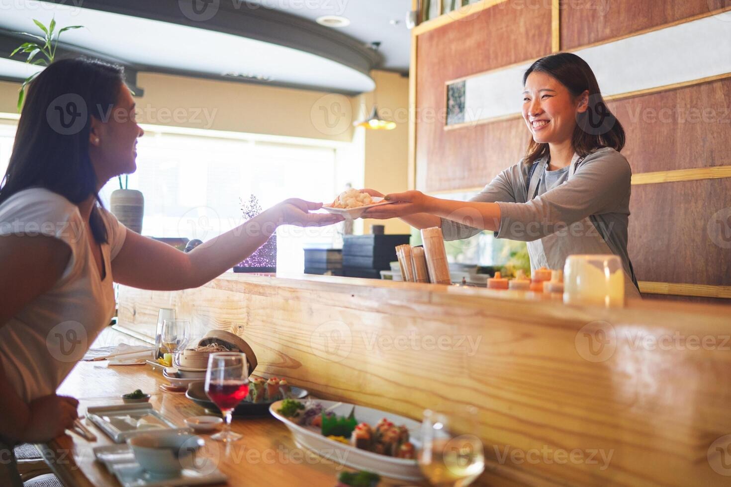 Imgi 231 sushi happiness and restaurant people customer and asian waitress giving food plate order or product japanese cashier server or startup small bu