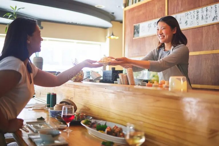 Imgi 241 sushi happiness restaurant people customer asian waitress giving food plate order product japanese cashier server startup