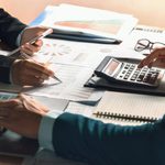 Imgi 364 businessman use calculator and computer for meeting with team accountant on desk in office finance and accounting concept free photo
