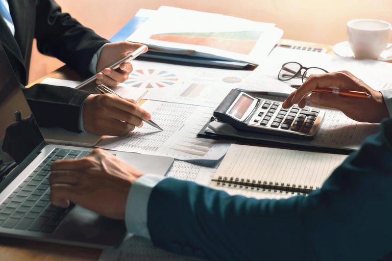 Imgi 364 businessman use calculator and computer for meeting with team accountant on desk in office finance and accounting concept free photo