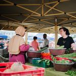 Local vendors and customers interact at Labis morning market, Johor, Malaysia.