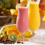 Vibrant smoothies made from fresh bananas, kiwi, and oranges, perfect for a healthy lifestyle.