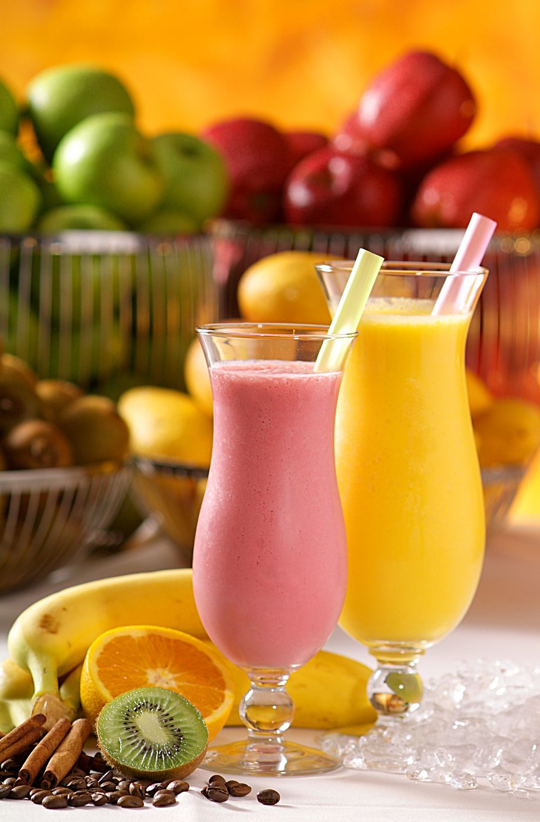 Vibrant smoothies made from fresh bananas, kiwi, and oranges, perfect for a healthy lifestyle.